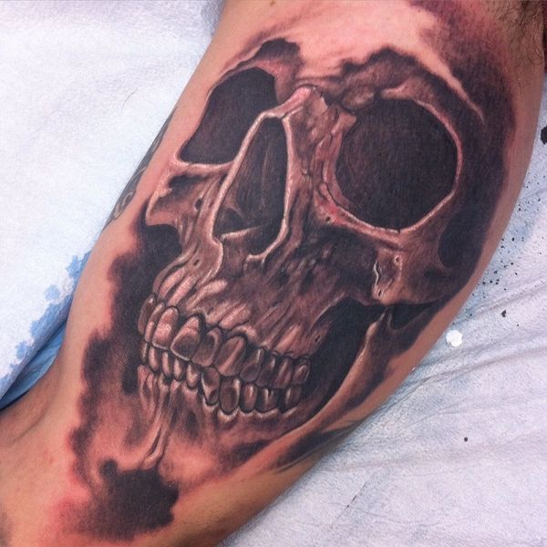 Excellent black and grey skull tattoo by Droopy