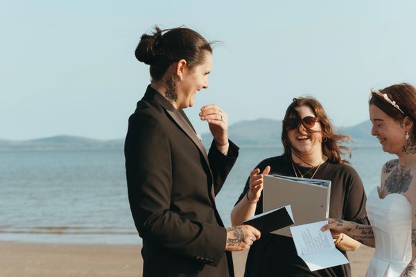 Elopement style wedding ceremony on Anglesey beach - LGBTQ+ lesbian wedding