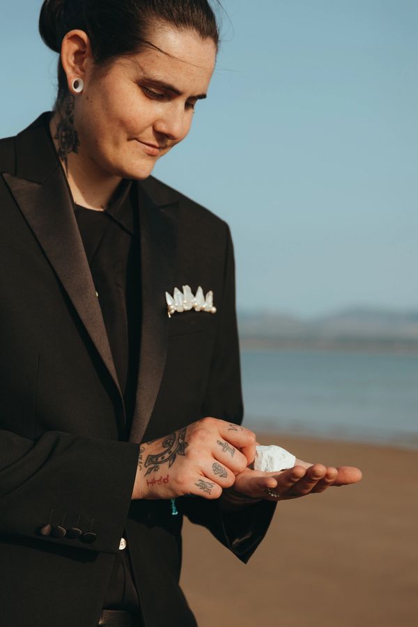 Intuition-led crystal ritual as part of a wedding ceremony, with beautiful raw crystal (howlite)