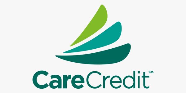 CareCredit logo with green and teal abstract shapes.