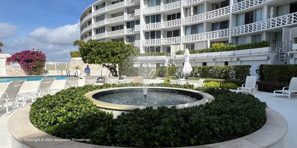 Regency, 2760 South Ocean Blvd., Palm Beach, fountain at pool deck, green foliage