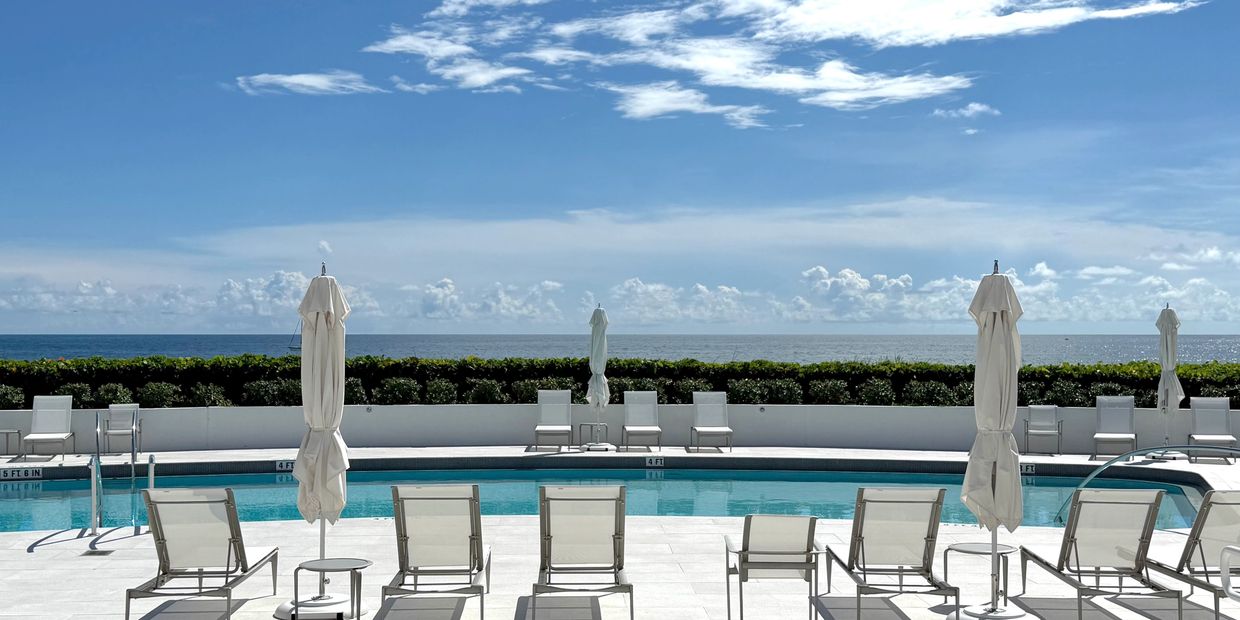 Atriums Palm Beach, 3400 S Ocean Blvd Palm Beach, Pool deck with white loungers