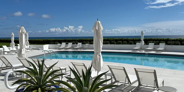 Atriums Palm Beach, 3400 S Ocean Blvd Palm Beach, Pool deck with green plants