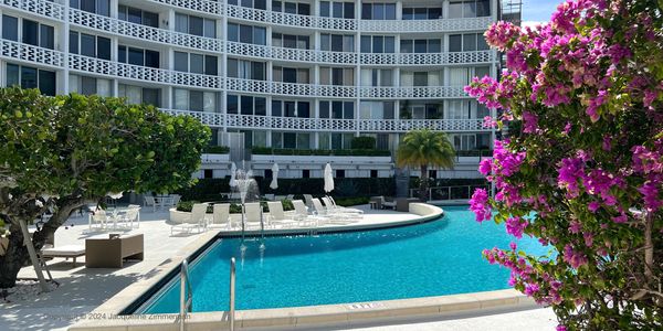 Regency, 2760 South Ocean Blvd., Palm Beach, pool deck with purple flowers