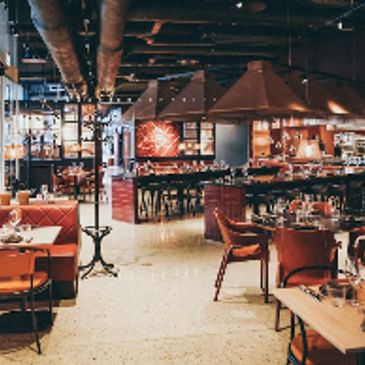 Cozy modern restaurant interior with warm lighting.