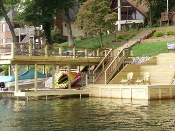 Wooden dock and stairway by a lakeside.