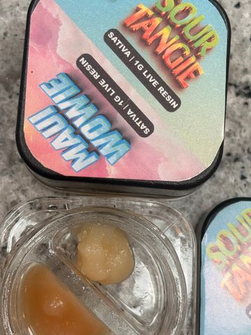 Container with two types of 1g live resin cannabis extracts labeled Sour Tangie and Maui Wowie.