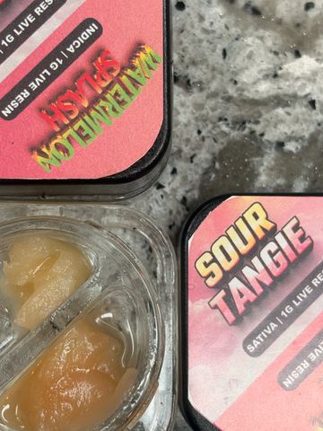 Two containers of cannabis live resin, Watermelon Slush and Sour Tangie.