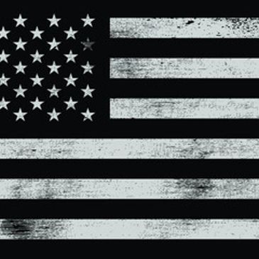 Grayscale American flag with a distressed texture.