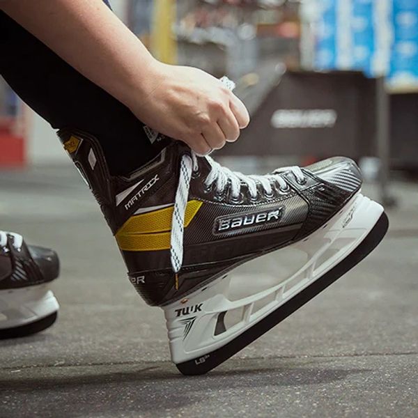 Photo of hockey skates being tied