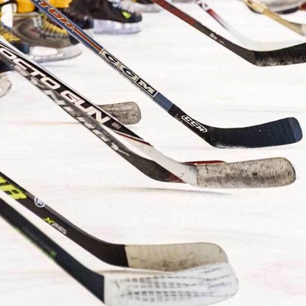 Image of hockey sticks on ice