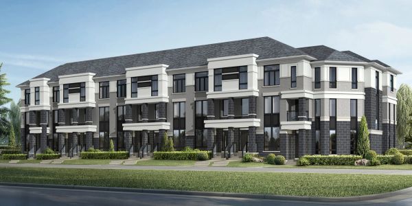 Modern multi-unit townhouses with gray and white exteriors and lush landscaping.