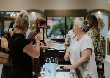 Group of women enjoying a wine tasting event.