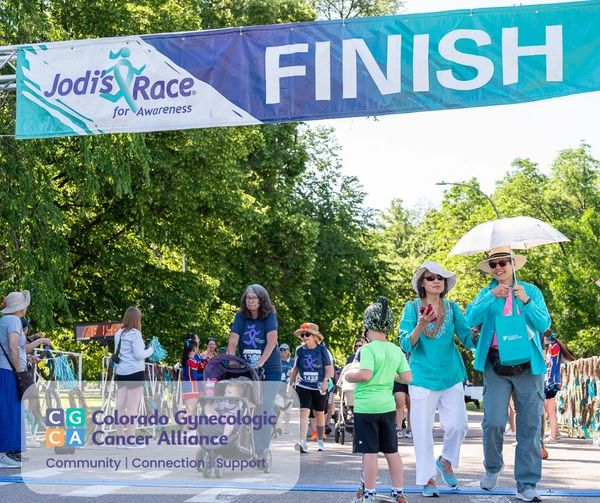 Participants crossing the finish line at Jodi's Race for Awareness event.
