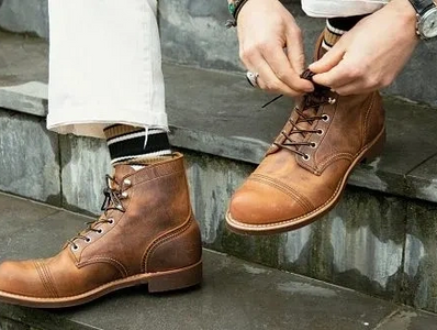 Man tying Red Wing Iron Rangers