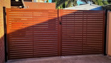 Popular wood look aluminium custom gates in Western Red Cedar 