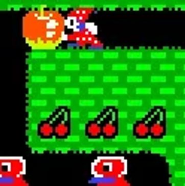 Pixelated retro video game scene with a character near cherries and an orange item.