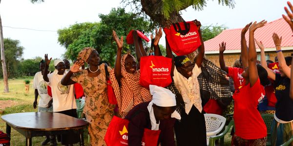 A group of Kenyan women celebrating with Enactus students.