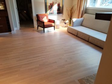 Sand and refinish with special process and color in downtown Chicago condo. 