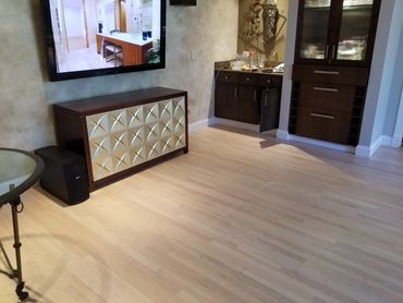 Sand and refinish with special process and color in downtown Chicago condo. 