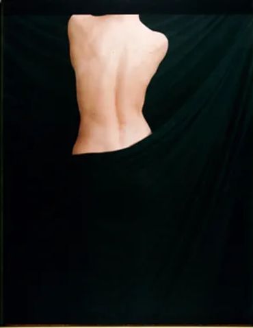 the backside of a topless woman and a black background 