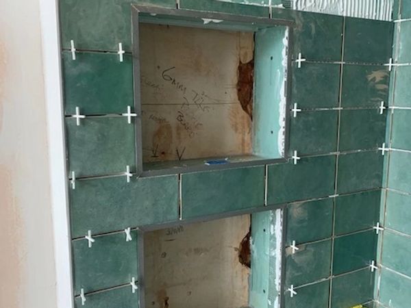 Bathroom remodel in Winchester. Full bathroom renovation in Winchester with recess shelving in showe