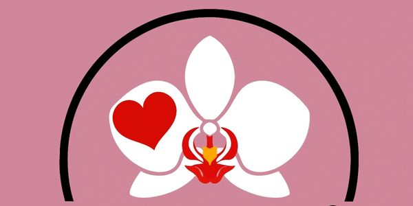 White orchid flower with a red heart on a pink background.