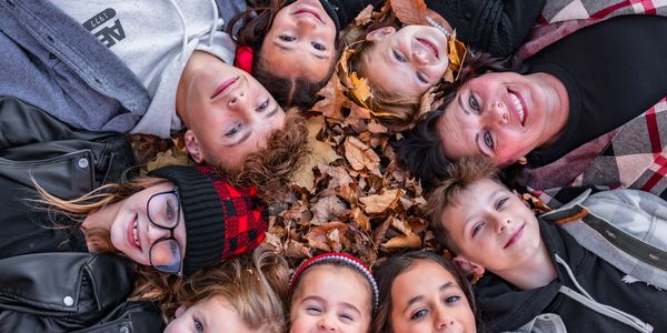 Photo of a group of kids laying down in a circle. Photos taken by Karl Alan Media.