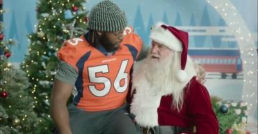 Denver Bronco Baron Browning #56 talking with Boulder CO. Mile High Santa Claus