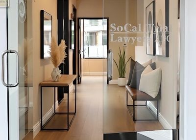 Modern office entrance with glass doors and stylish interior decor.
