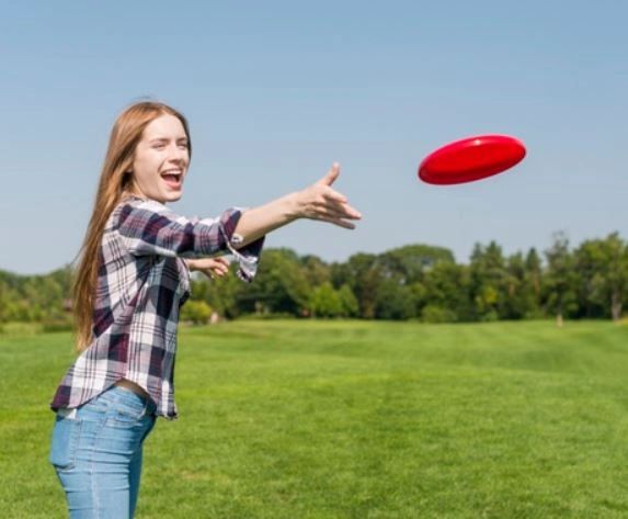 Woman playing frisbee in the park
