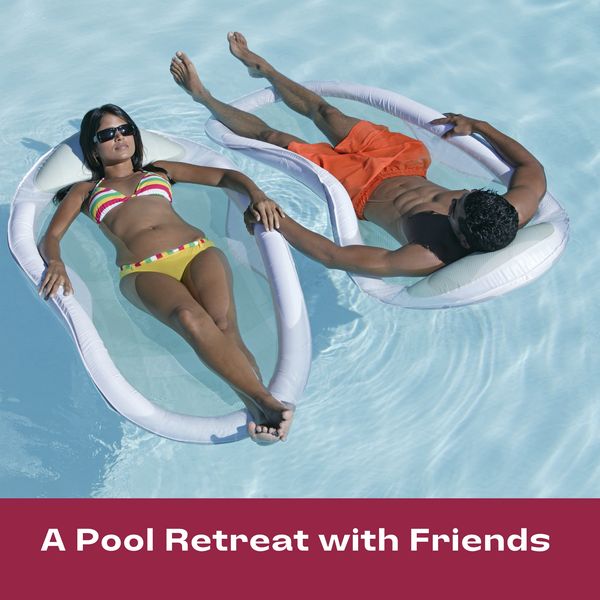 couple floating on a raft in a pool which. represents what a sound bath can be like on water.