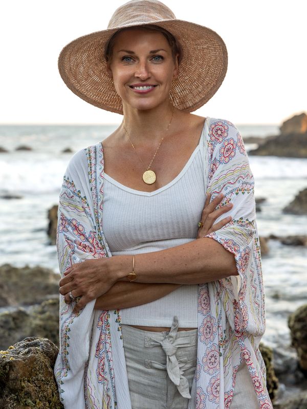 Nicole, smiling, confident that she can help you overcome stage fright and fear of public speaking.