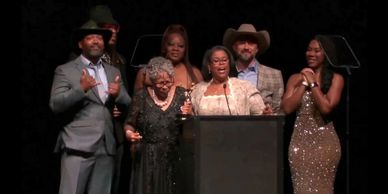 Our team accepting the Emmy for our annual broadcast of Opals Walk for Freedom LIVE! 