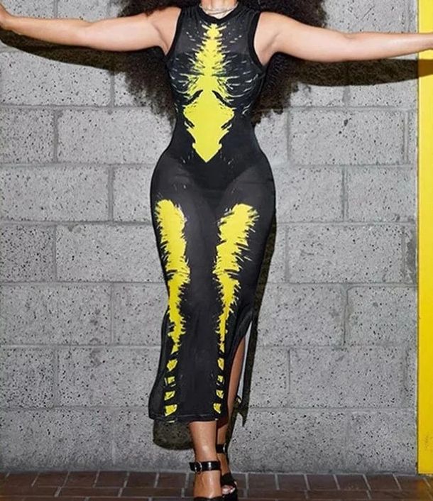 a woman wearing a black and yellow gown 