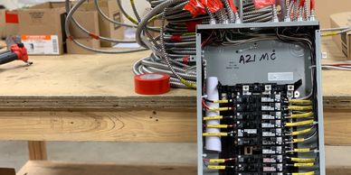 Electrical panel with labeled breakers and organized wiring panel upgrades and new circuit additions