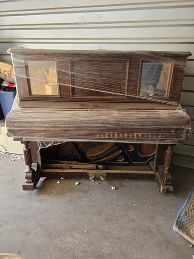 Upright piano removal job completed by DGT Junk Removal in the Mesa Arizona