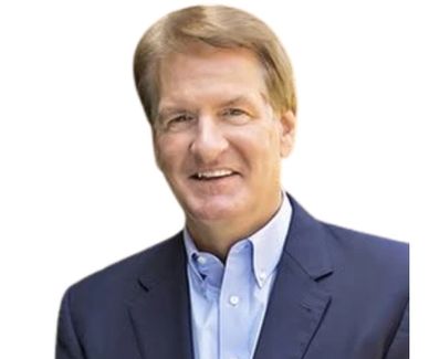 Smiling man in a blue suit with a light blue shirt.