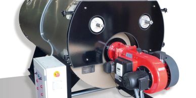 Industrial boiler with control panel and gauges.