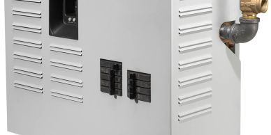 Close-up of a metal appliance with vents and pipe.