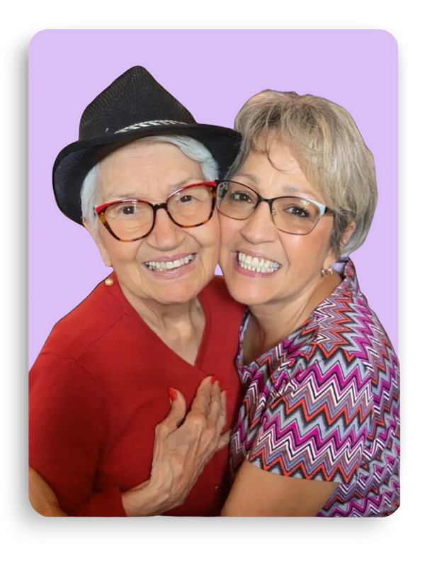 Diana and her mother hugging with big smiles.
