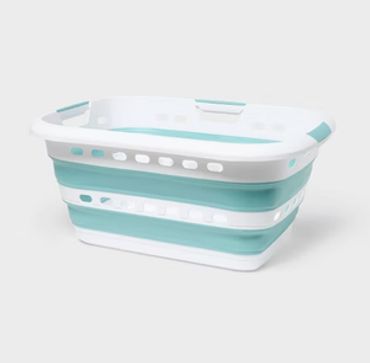 Collapsible laundry basket in white and teal.