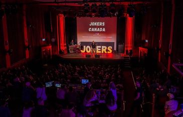 Performer on stage at Jokers Canada event.