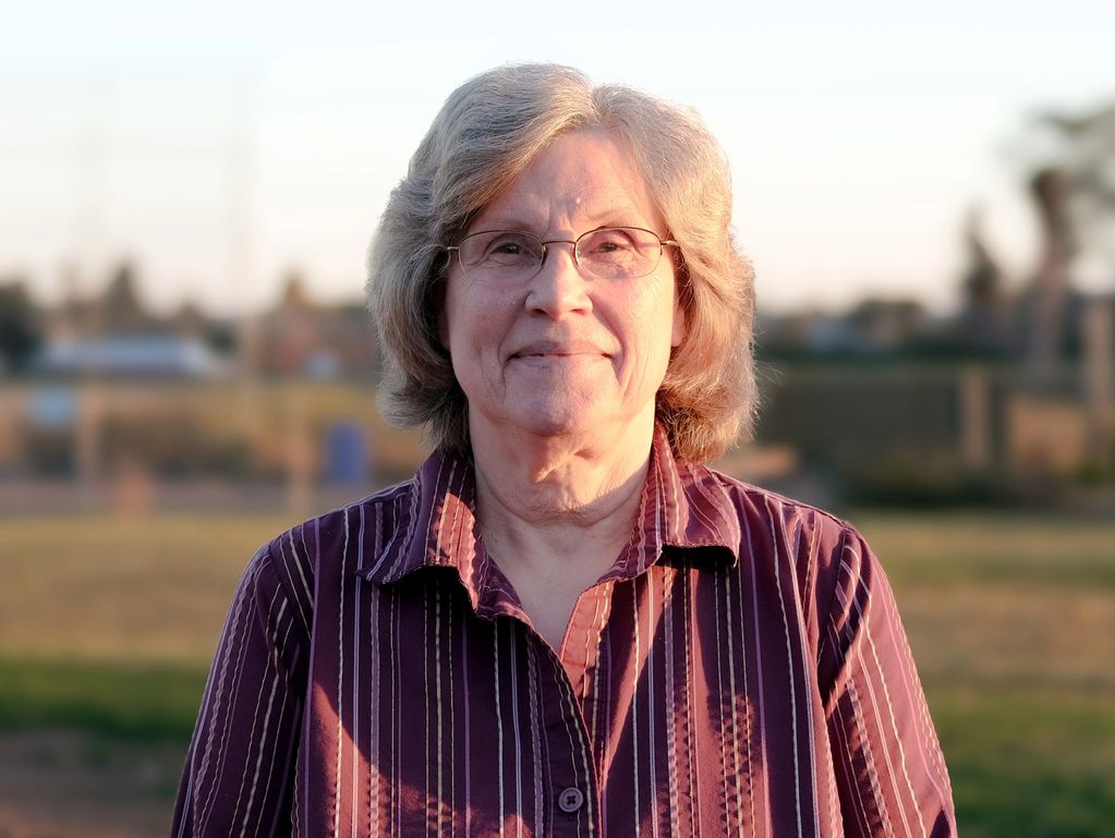 A woman standing on the pitch