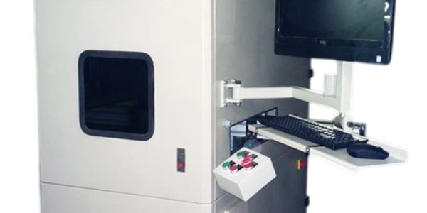Industrial machine with control panel, monitor, and keyboard.