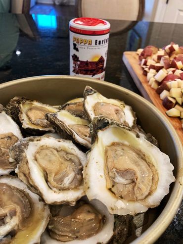 Shucking oysters and eating with the Best Cajun and Louisiana Seasoning Poppa Earles