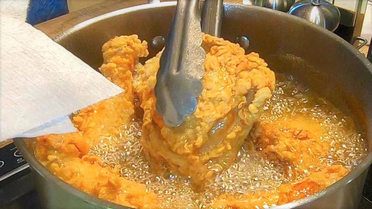 Chef Jesse using Poppa Earle's Louisiana Fish Fry to fry some fish.