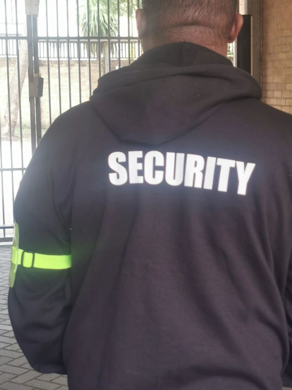 Residential security securing the back gates of a private property.