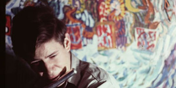 Jeremy Steig and his mural. Photo by Andrew Smith. 