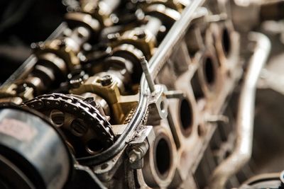 Close-up of an engine's internal components showing camshaft and timing chain.